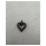 A sterling silver heart with a diamond stone