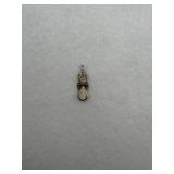 A sterling silver drop charm with a mother of
