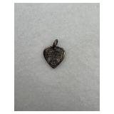 Sterling silver charm featuring a heart shaped