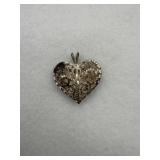 Sterling silver heart pendant with intricate