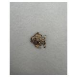 A sterling silver fish charm