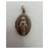 A sterling silver locket of the Virgin Mary