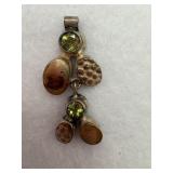 Sterling silver pendant with green gemstone with