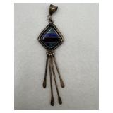 A Navajo style design with a lapis and turquoise