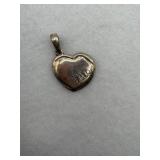 A sterling silver puffy heart pendant with a