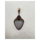 A sajen sterling silver pendant with a triangular
