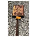 Slow children playing sign on pole