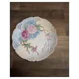 This vintage porcelain plate features