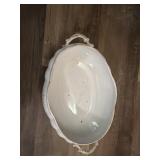 This is a vintage Limoges porcelain oval serving