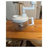 This white hand-cranked vegetable chopper from