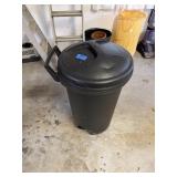 Black plastic trashcan with wheels and lid