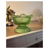 This vintage Duncan & Sons vaseline glass footed