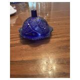 This pressed glass butter dish features a deep