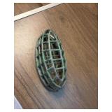 This green metal item is a vintage Dazey