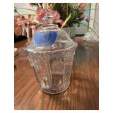 This clear glass jar resembles an Early American