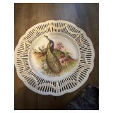 This porcelain reticulated bowl features a