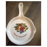 This white ceramic spoon rest features a festive