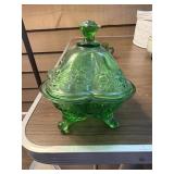 This vintage green pressed glass lidded candy
