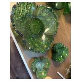 This vintage emerald green glass bowl features a