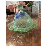 This is a vintage green Depression glass covered