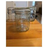 This vintage-style clear glass jar features a