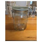 This vintage-style clear glass jar features a