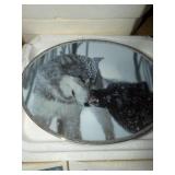 This oval mirror features a high-contrast black