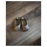 Brass shoes
