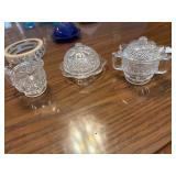 These vintage pressed glass items feature a