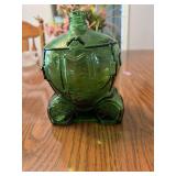 This vintage green glass decanter is designed in