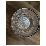This vintage cut glass serving bowl features a