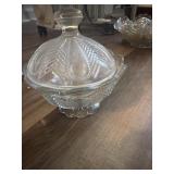 This vintage clear glass candy dish features a