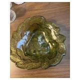 This is a vintage green glass bowl made by the