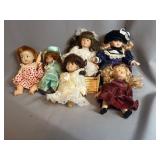 Six Porcelain and Vinyl Dolls