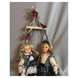 Porcelain Boy and Girl Dolls on Hanging Swing