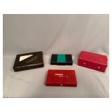Four Domino Sets in Cases