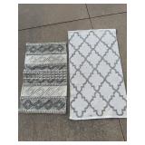 Two Safavieh Grey and Ivory Accent Rugs