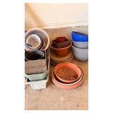 Mixed Plastic and Clay Garden Pots and Saucers
