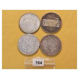 Four AU Morgan Silver Dollars