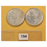 Two AU Morgan Silver Dollars