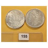 Two AU Morgan Silver Dollars