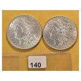 Two AU Morgan Silver Dollars