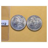 Two AU Morgan Silver Dollars