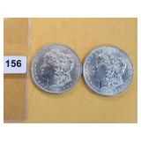 Two AU Morgan Silver Dollars