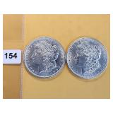 Two AU Morgan Silver Dollars