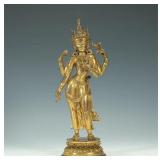 GILDED FOUR-ARMED BODHISATTVA FROM THE MING...