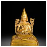 A GILDED BRONZE STATUE OF MASTER TSONGKHAPA...