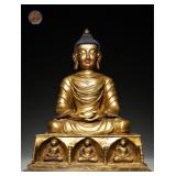A GILDED BRONZE STATUE OF SAKYAMUNI BUDDHA FROM...