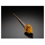 A GILDED BRONZE HAIRPIN INLAID WITH RUBIES