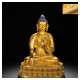 A GILDED BRONZE STATUE OF SAKYAMUNI PREACHING...